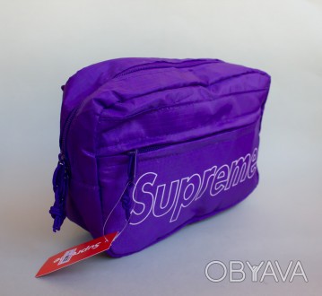 Фиолетовая сумка на плечо или пояс Supreme.
Материл 100% полиестер.
Размеры бана. . фото 1