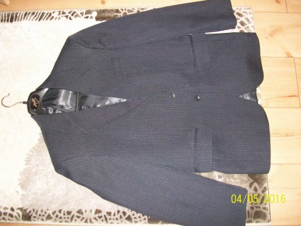 Продам, новий  чоловічий  костюм  темно - сірого  кольору     в полоску.  Виробн. . фото 2
