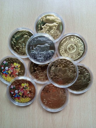 Сувенирные монеты с изображением Быка, символа 2021 года. Бык расположен на моне. . фото 3