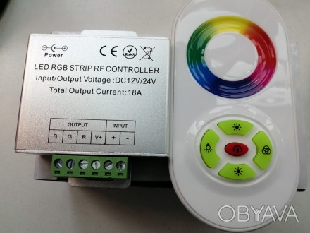 Кнопочный радиопульт с сенсорным кольцом белого цвета для управления RGB ленты.
. . фото 1