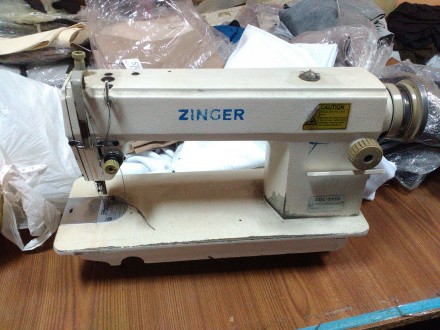Промышленная швейная машинка Zinger, б/у.

Имеет 3-х фазный двигатель 380 воль. . фото 2