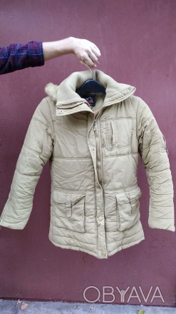 Продам зимнюю куртку/пальто, на девочку лет 7-10.
Салатового цвета. Без пятен, . . фото 1