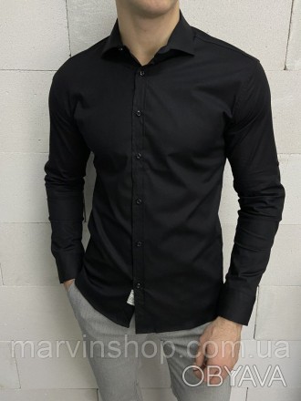 
Классическая однотонная чёрная рубашка.
Качественный пошив.
95% коттон, 5% элас. . фото 1