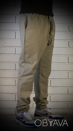 Бежевые мужские брюки джоггеры свободного кроя. Внизу штанин резинка. В пояс вши. . фото 1