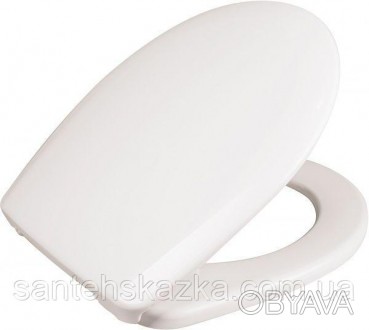 Сиденье для унитаза белого цвета изготовлено из полипропилена, имеет овальную фо. . фото 1