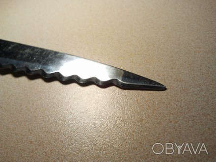 Кухонный нож из высококачественной нержавеющей стали.
Есть надпись. Изготовлен . . фото 1