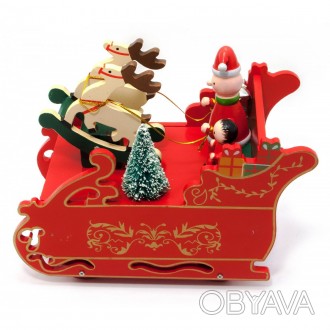 Деревянная музыкальная игрушка представляет из себя новогодние сани с дедом Моро. . фото 1