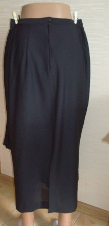Красивая нарядная женская юбка черного цвета. По тали застегивается на пуговицу . . фото 6