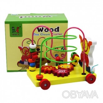 Деревянная развивающая игрушка. В ней есть клоун с часами, движущиеся шестерни и. . фото 1