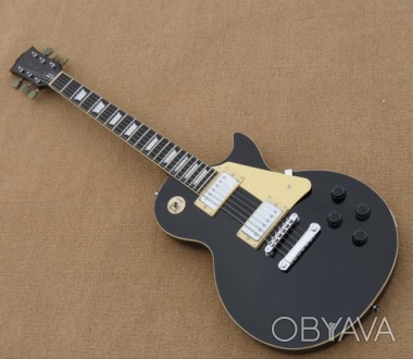 Электрогитара Gibson Les Paul Standard Black Top China
Красивая электрогитара мо. . фото 1