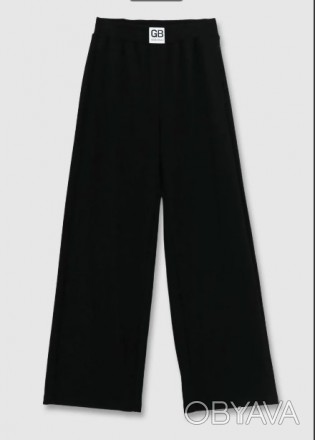 Широкие брюки в спортивном стиле для девочки сшиты из смесового трикотажа с высо. . фото 1