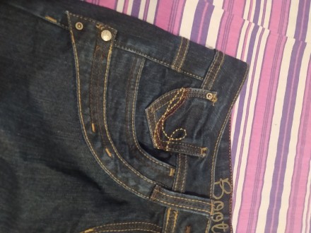 Продам джинси темно-синього кольору. Трохи розклешені донизу. Розмір вказан 12. . . фото 2