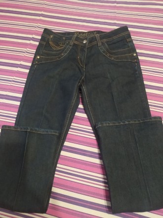 Продам джинси темно-синього кольору. Трохи розклешені донизу. Розмір вказан 12. . . фото 4