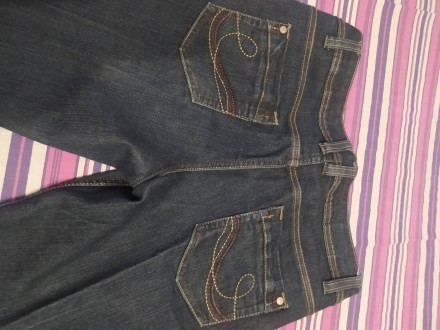 Продам джинси темно-синього кольору. Трохи розклешені донизу. Розмір вказан 12. . . фото 5
