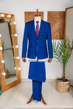 
ІНФОРМАЦІЯ ПРО ПРОДУКТ
Чоловічий яскраво синій класичний костюм піджак та штани. . фото 2