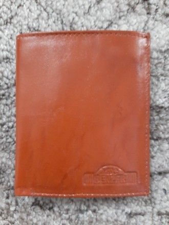 Кожаный коричневый кошелек Benzer (Индия)

Снаружи хорошая кожа
Внутри немнож. . фото 2