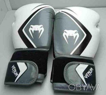Тип перчаток	тренировочные
Вид спорта	бокс
Вес	12 унций
Материал	искусственная к. . фото 1
