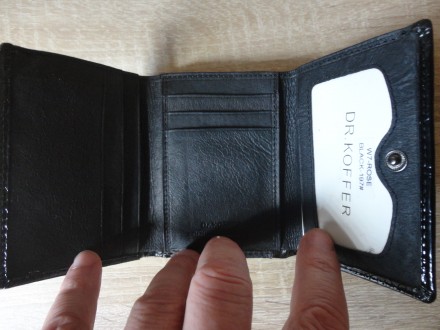 Женский кожаный кошелек Dr.Koffer (черный) 

Хорошее качество
Кожаный, с деко. . фото 5