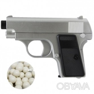 Пластиковый пистолет с пульками в комплекте. Магазин может содержать 14 шариков . . фото 1