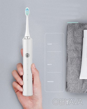 Електрична зубна щітка — це пристрій для чищення зубів, який працює від електрич. . фото 1