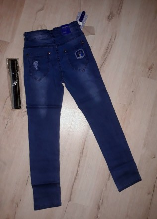 
Брюки из джинса для мальчиков от фирмы Taurus. Модель стильная, украшена латкам. . фото 3