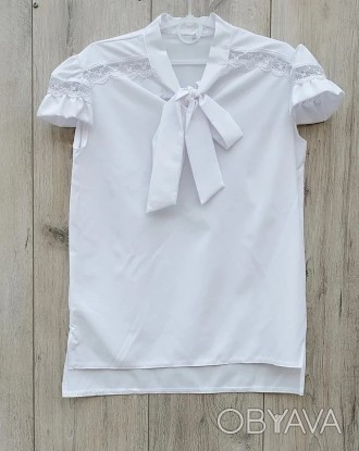 
Блузка для девочки с коротким рукавом, сзади удлиненная 
Размерный ряд:
146 -дл. . фото 1