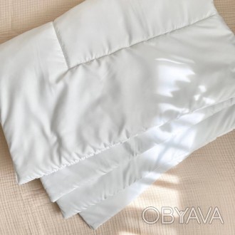 Одеяло детскоеПодходит как для стандартных, так и для овальных кроваток. Цвет: б. . фото 1