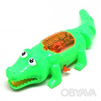 Большая заводная игрушка в виде крокодила. Заводится при помощи ключика сбоку, п. . фото 1