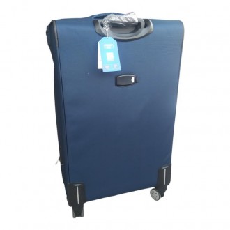 Якісна дорожня валіза на 4 колесах сиьго кольору виконана з щільної тканини Cord. . фото 3