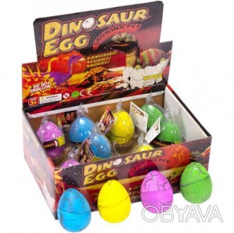 ![CDATA[Іграшка "Яйце динозавра" різних кольорів, при опусканні в воду виростає . . фото 1