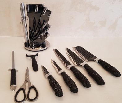 Опис:
Набір ножів із підставкою з неіржавкої сталі UNIQUE UN-1831 9 предметів
Що. . фото 4