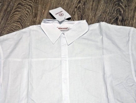 Классическая рубашка оверсайз из хрустящей хлопковой ткани. Воротник и потайная . . фото 6