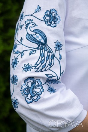 
	
	Лляна жіноча вишиванка біла блуза із синім орнаментом.
	На сьогодні вишиванк. . фото 1
