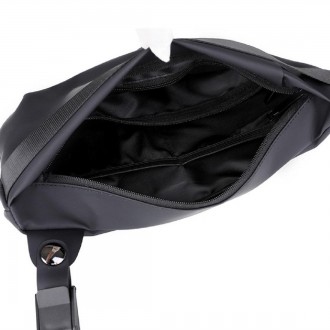 
	Вместительная сумка слинг Confident ATN02-M2A пошита из черной ткани.
Размеры . . фото 5
