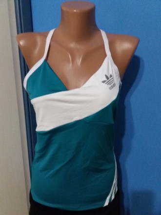 Жіноча спортивна майка Adidas
Розмір: 40, 44, 46
Колір: бірюзовий
Матеріал: дайв. . фото 3
