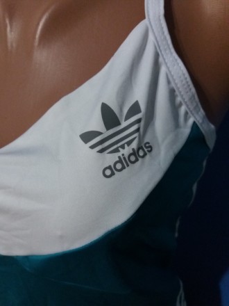 Жіноча спортивна майка Adidas
Розмір: 40, 44, 46
Колір: бірюзовий
Матеріал: дайв. . фото 6