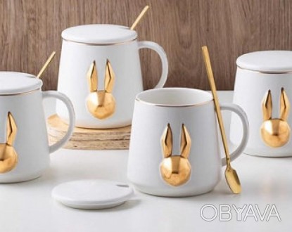 Чашка Золотий зайчик з кришкою та ложкою
Оригінальна та красива чашка із золотим. . фото 1