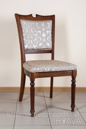 Деревянный обеденный стул в классическом стиле, сидение и спинка обиты тканью.
Ц. . фото 1