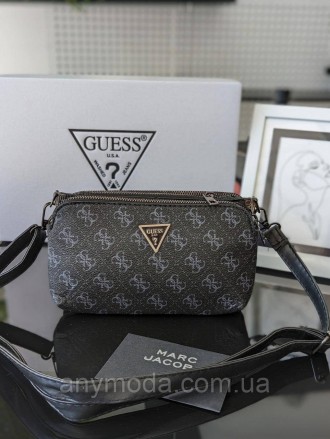 Жіноча сумка-гаманець Guess ?Прикрашена фірмовим логотипом Guess. 
Цвет:
Чорний
. . фото 2