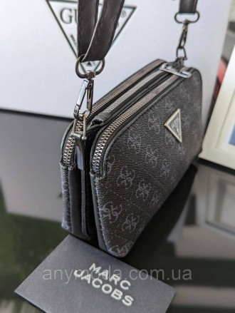 Жіноча сумка-гаманець Guess ?Прикрашена фірмовим логотипом Guess. 
Цвет:
Чорний
. . фото 3