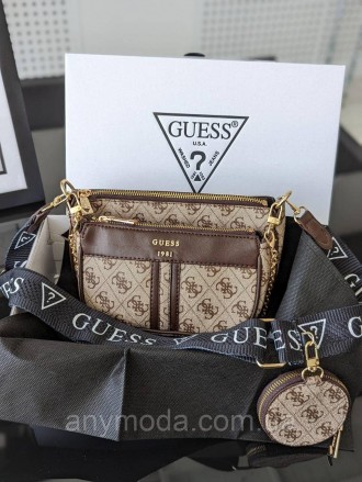 Женская сумка Guess ?Украшена фирменным логотипом Guess
Цвет:
бежевый
- Фурнитур. . фото 2