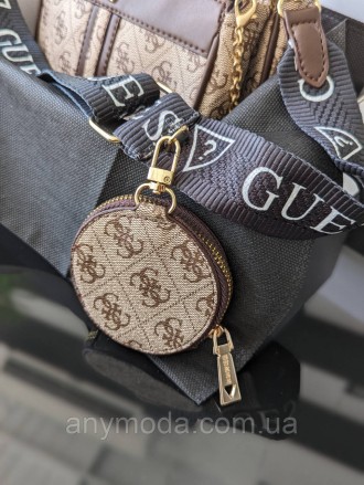 Женская сумка Guess ?Украшена фирменным логотипом Guess
Цвет:
бежевый
- Фурнитур. . фото 5