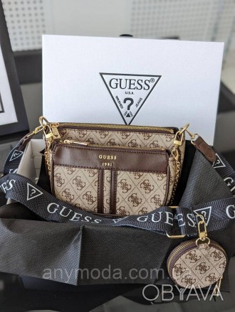 Жіноча сумка Guess ?Прикрашена фірмовим логотипом Guess
Цвет:
бежевий
- Фурнітур. . фото 1
