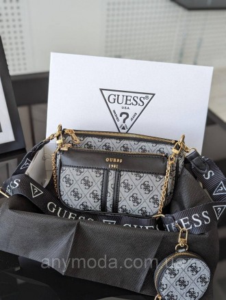 Жіноча сумка Guess ?Прикрашена фірмовим логотипом Guess
Цвет:
сірий
- Фурнітура . . фото 2