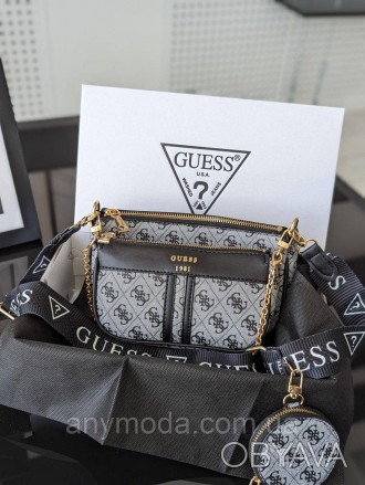 Жіноча сумка Guess ?Прикрашена фірмовим логотипом Guess
Цвет:
сірий
- Фурнітура . . фото 1