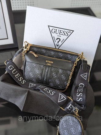 Женская сумка Guess ?Украшена фирменным логотипом Guess
Цвет:
черный
- Фурнитура. . фото 2