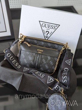 Женская сумка Guess ?Украшена фирменным логотипом Guess
Цвет:
черный
- Фурнитура. . фото 1