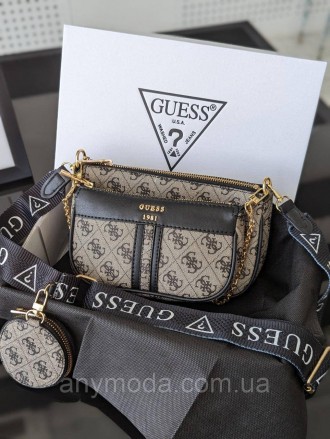 Женская сумка Guess ?Украшена фирменным логотипом Guess
Цвет:
серый
- Фурнитура . . фото 2