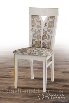 Обідній дерев'яний стілець із напівм'якими сидінням і спинкою, оббитими тканиною. . фото 1
