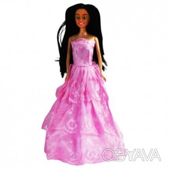 Лялька пластикова. Має гарне рожеве плаття та чудове чорне волосся. Також поверт. . фото 1